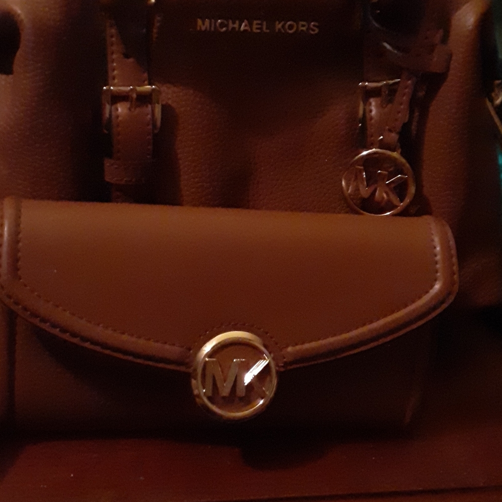 This is a Michael Kors handbags small with wallet